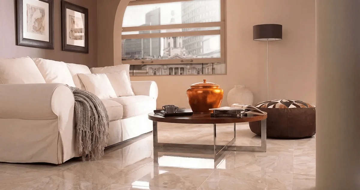 Modern living room with professionally installed marble flooring, a beige sofa, coffee table in West Palm Beach, FL
