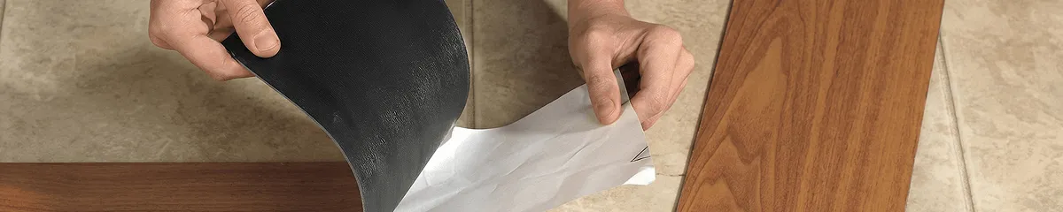 A professional installing vinyl flooring in West Palm Beach, FL
